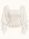 The Bella Tie Top — Ivory Textured Smocked Blouse